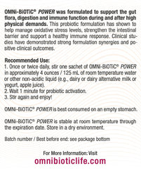 Glass of water with stirred OMNi-BiOTiC Power solution, illustrating quick reconstitution for gut support.