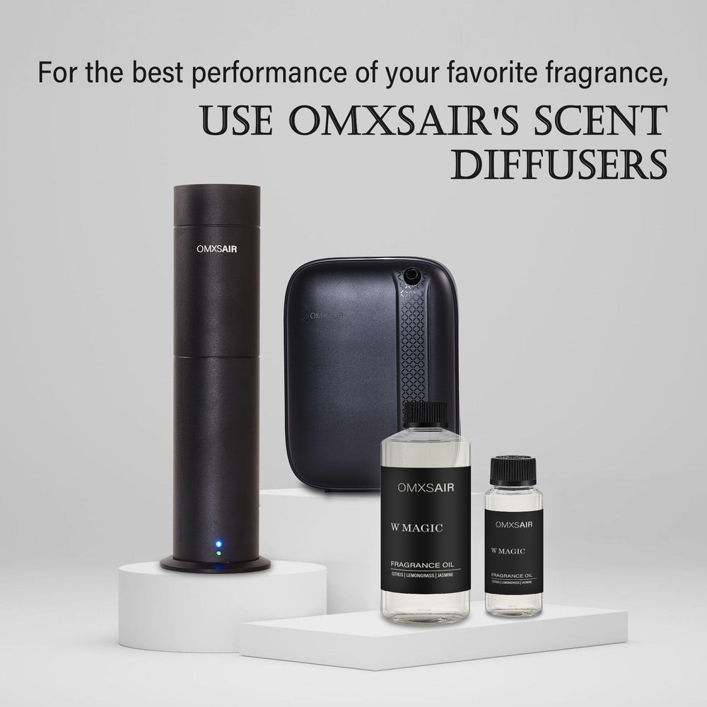Omxsair W Magic diffuser oil bottle in a softly lit room evoking luxury atmosphere.