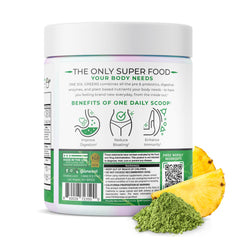 One Sol Greens scoop with powder ready to mix into smoothie.
