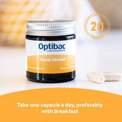 Optibac Travelling Abroad bottle on a travel-ready setup with 20 capsules