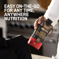 Close-up of chocolate flavor label on Gold Standard bottle highlighting protein content.