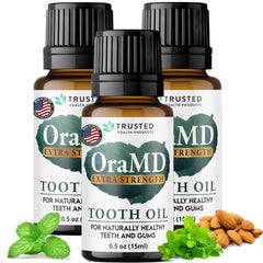 OraMD 4-in-1 Extra Strength Tooth Oil bottle with pour promotes gum health.