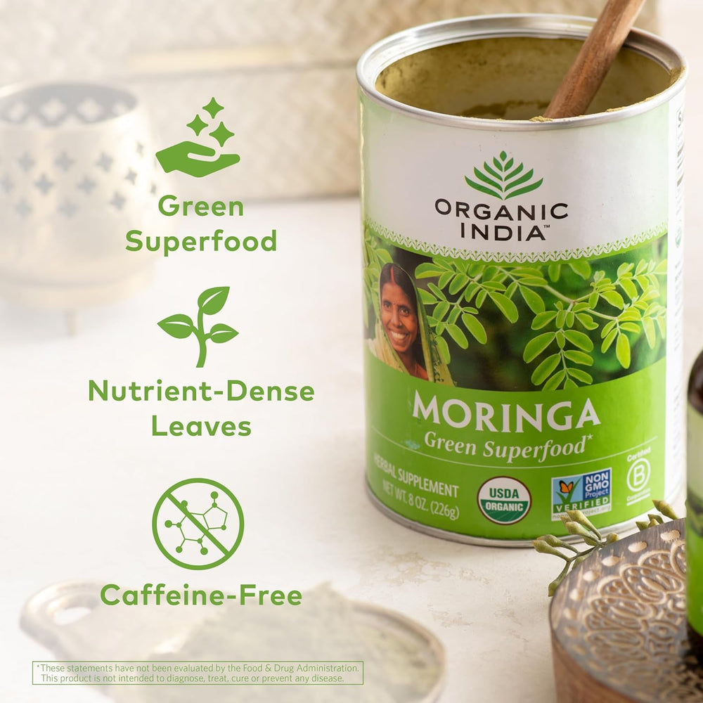 Organic India Moringa powder scoop ready to mix into beverages