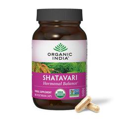 Organic India Shatavari capsules bottle on counter, supporting hormonal balance.