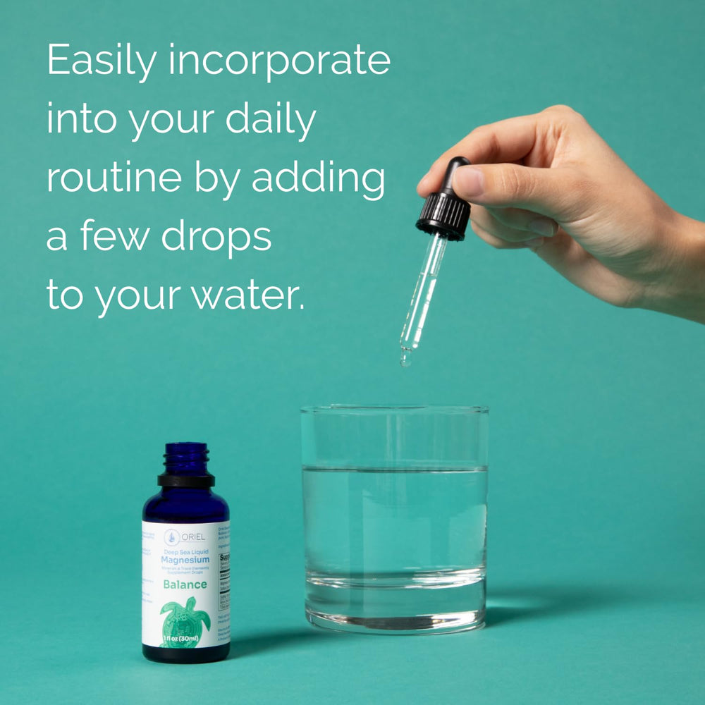 Glass of water with Oriel Liquid Magnesium Drops dissolving for hydration support.