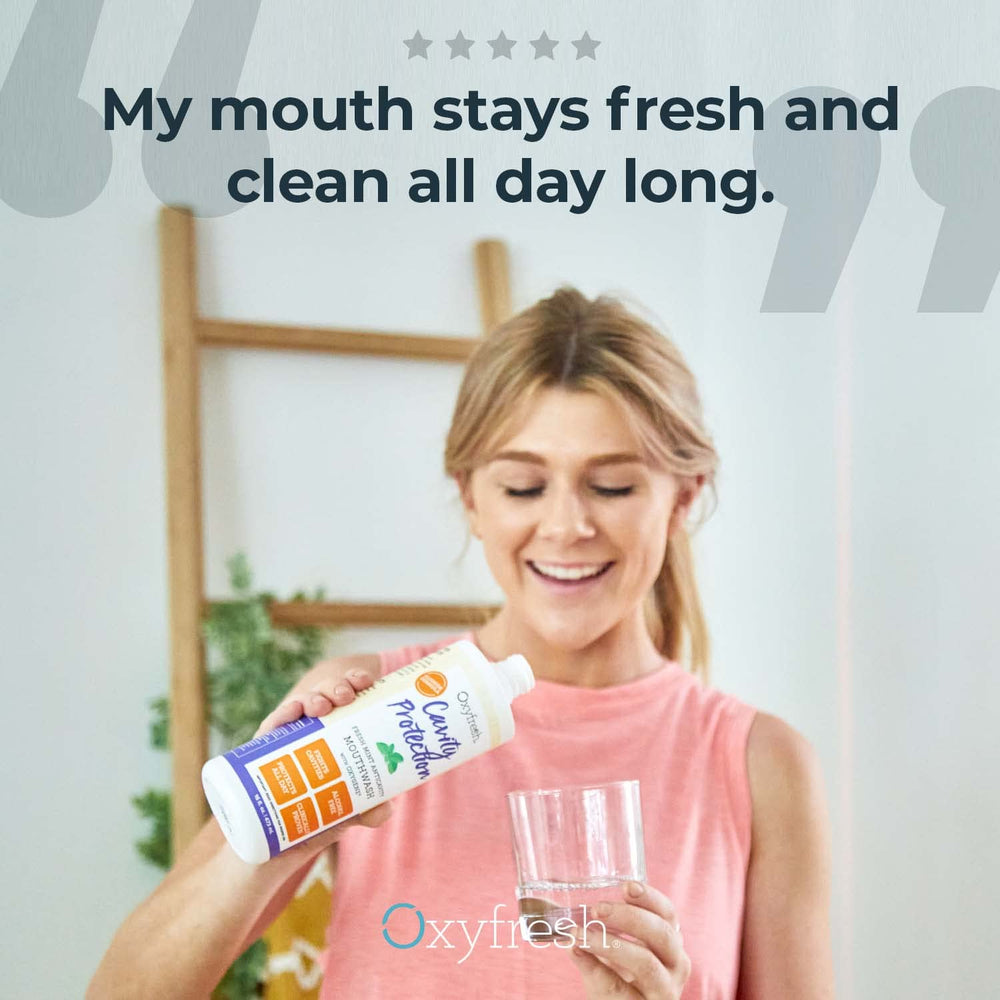 Pouring Oxyfresh Mouthwash from bottle into cap for daily use.