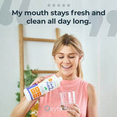 Pouring Oxyfresh Mouthwash from bottle into cap for daily use.