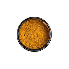 PAAVANI Golden Milk tub close-up highlights vibrant turmeric color.