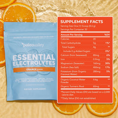 Paleovalley Essential Electrolytes Orange lifestyle shot with active user.