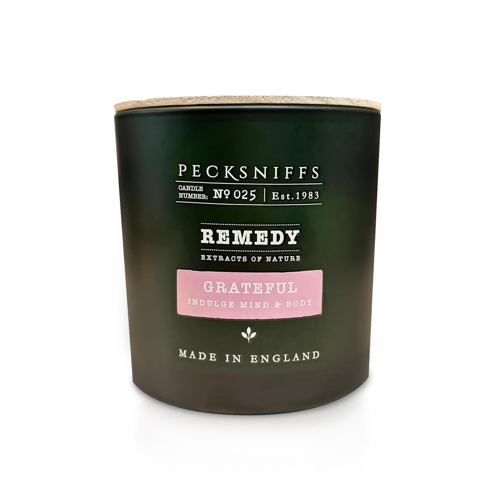Pecksniff's Grateful Candle three-wick jar for balanced, even burn.