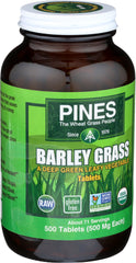 Close-up of Pines Organic Barley Grass tablets for a clean, green daily supplement.