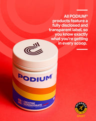 Scoop of Podium Solos pink lemonade creatine in water for fast dissolution.