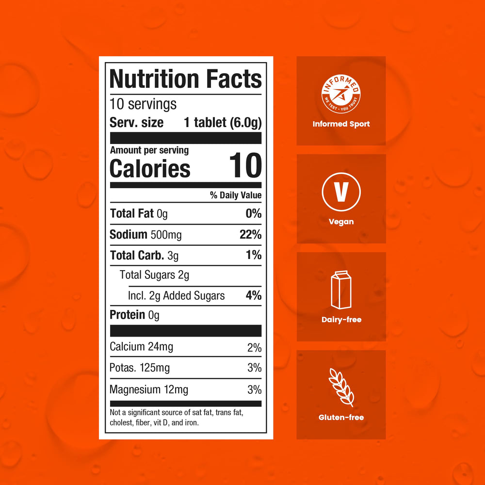 Precision Hydration orange tablets in a glass with a refreshing fizz.