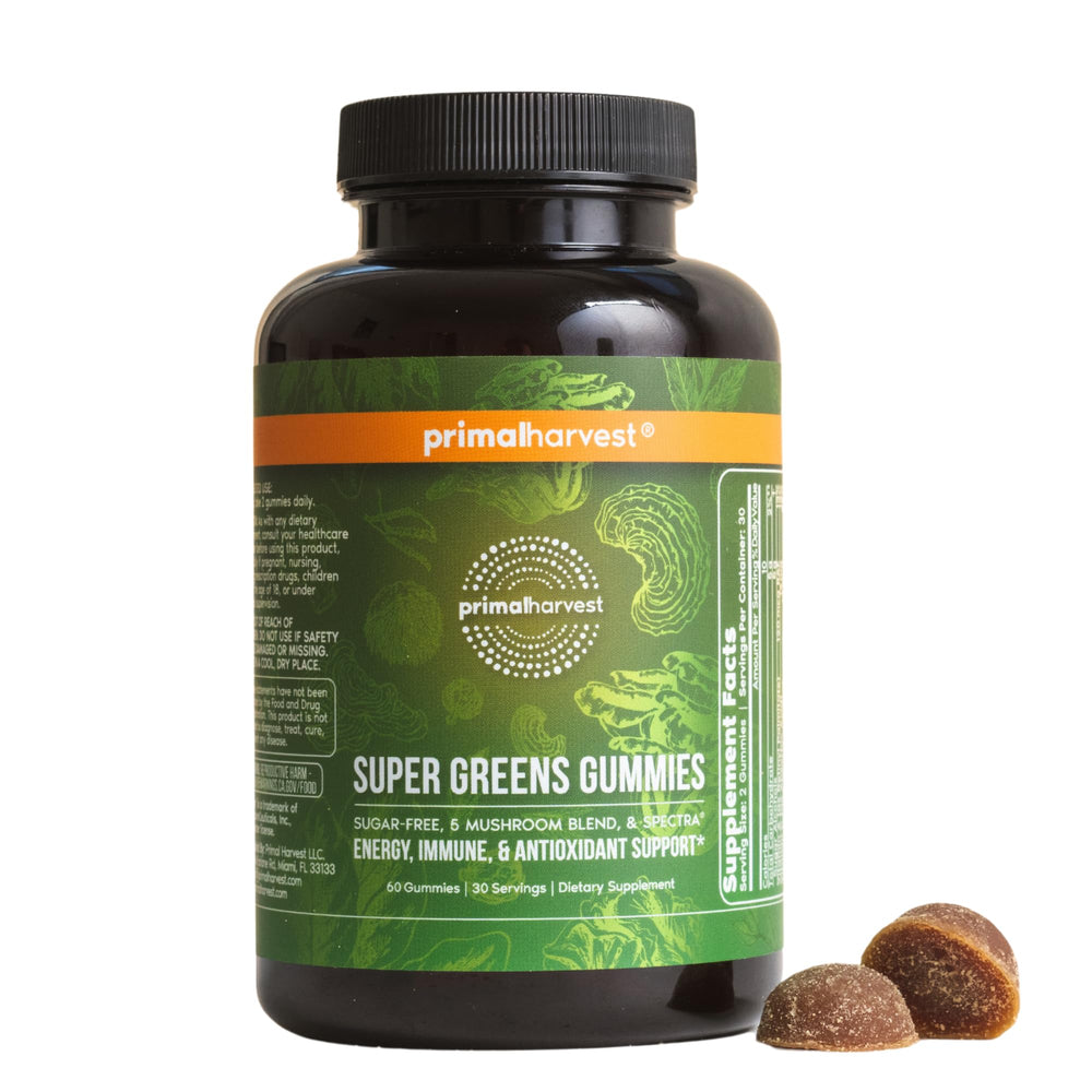 Primal Harvest Super Greens Gummies bottle on kitchen counter, supports daily greens intake and energy