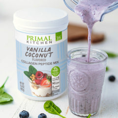 Primal Kitchen Collagen Fuel Vanilla Coconut on kitchen counter with ingredients