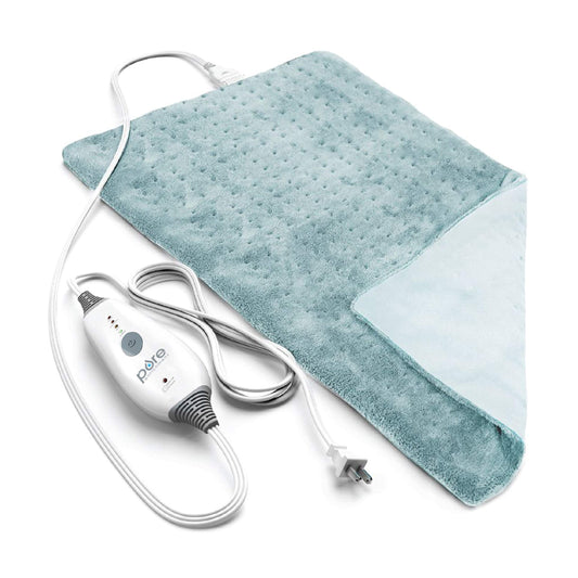 Pure Enrichment PureRelief Deluxe Sea Glass heating pad on bed for targeted back warmth