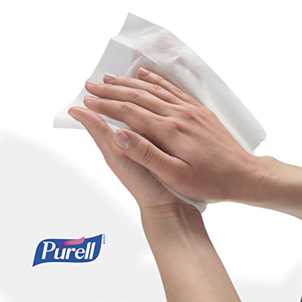 Purell wipes displayed on an office desk for convenient hand hygiene.