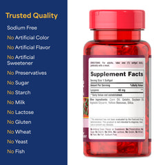 Puritan's Pride Lycopene 40mg bottle with glass of water for daily intake.
