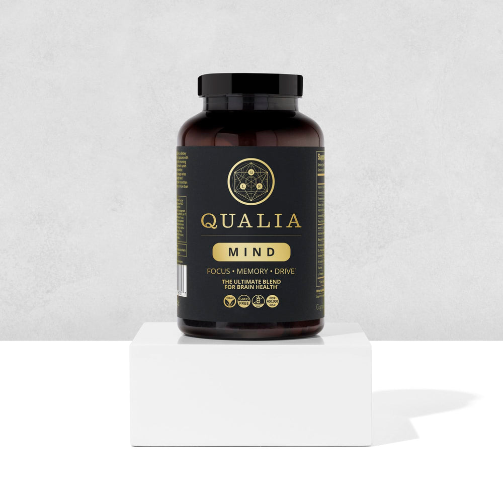 Qualia Mind packaging highlighting vegan, non-GMO, gluten-free standards