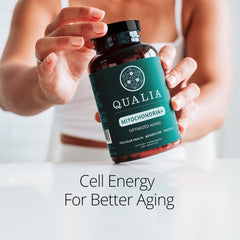 Qualia Mitochondria+ glass jar with gold cap seen as premium supplement for aging support.