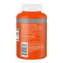 Qunol Turmeric capsules beside a glass of water for easy daily use.