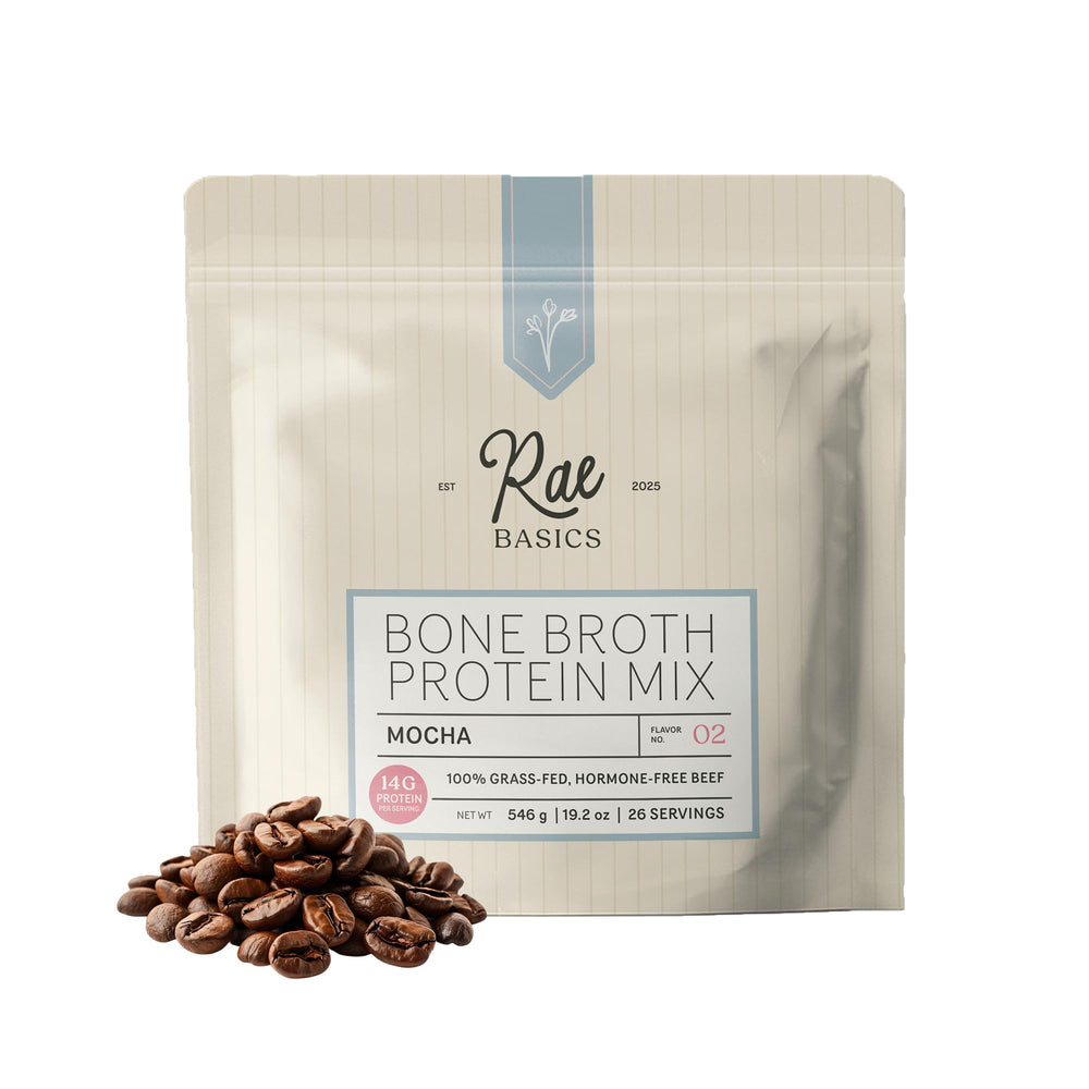 Rae Basics Mocha Bone Broth Protein bottle on kitchen counter for morning nourishment.