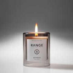 Range Essentials Refresh Candle cotton wick close-up showing steady flame and clean burn.
