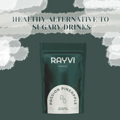 Rayvi glass with bright pineapple drink illustrates refreshing electrolyte hydration.