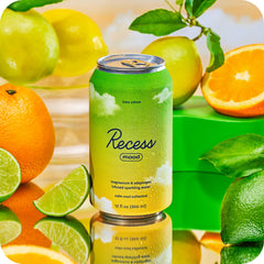 Pouring Recess Mood Lime Citrus into a glass with vibrant bubbles.