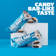 MRE Bar cookies & cream shown in an on-the-go snack scenario.