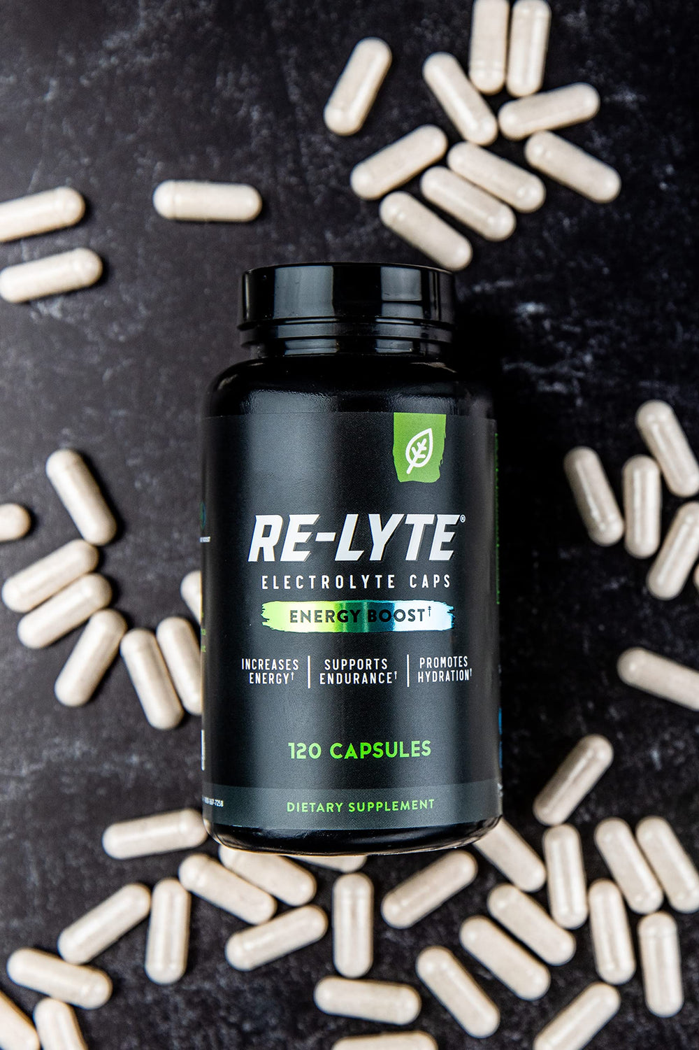 Redmond Energy Boost capsules dispense demonstrates a two-capsule serving with natural caffeine and electrolytes.