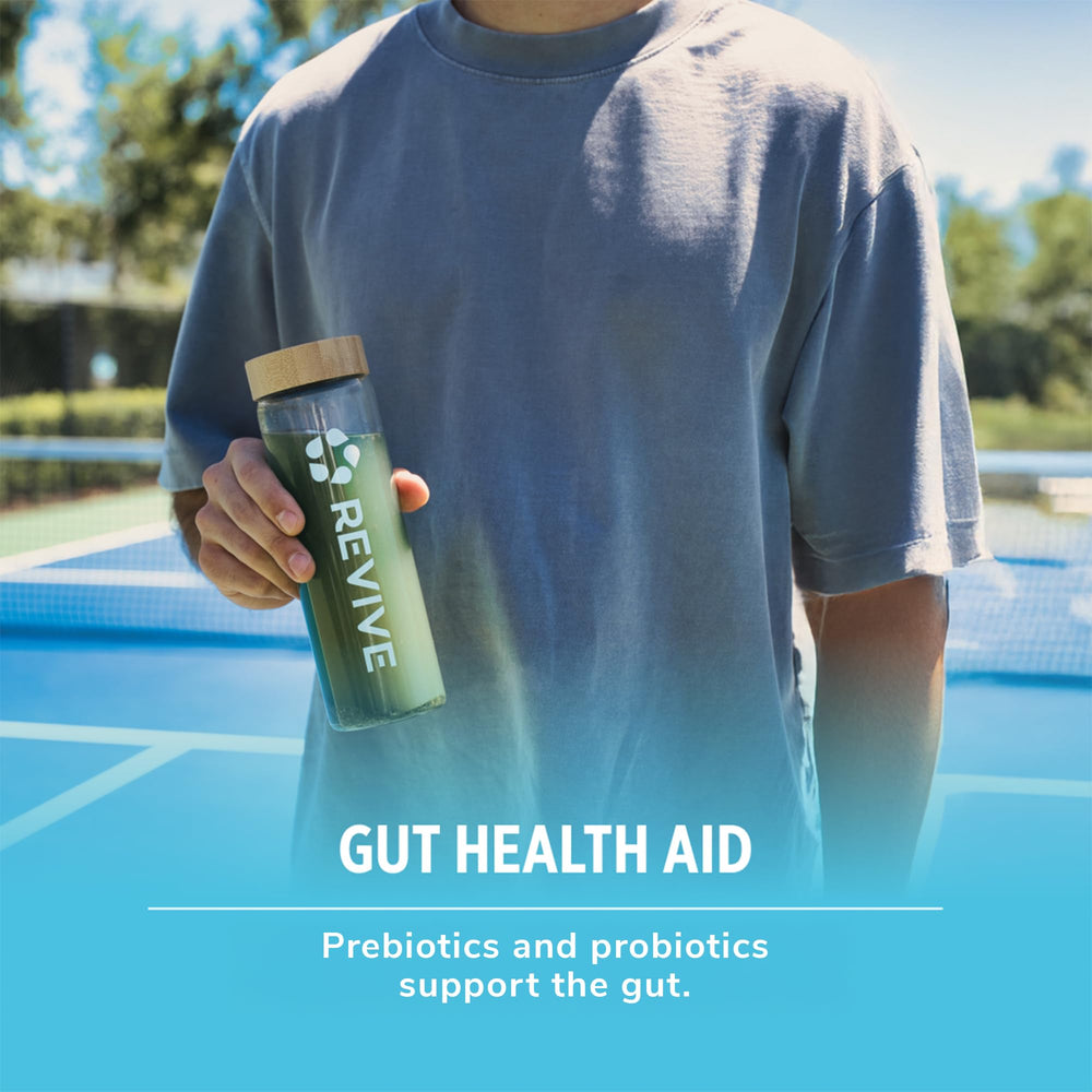 Label close-up on Revive MD Daily Green Powder showing vegan, gluten-free badges.