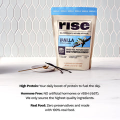 Rise Grass-Fed Whey Vanilla shake being poured for on-the-go use