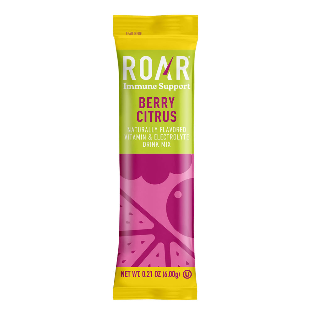 ROAR electrolytes powder on desk with ingredients, gluten-free and GMO-free.