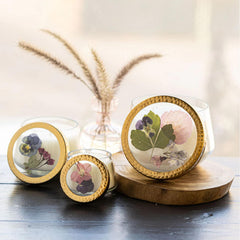 Rosy Rings Blushing Rosewood candle lid with pink larkspur and purple pansy botanicals