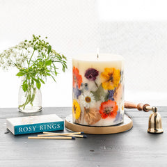 Rosy Rings Essence of Spring candle on a shelf enhances room decor with floral notes