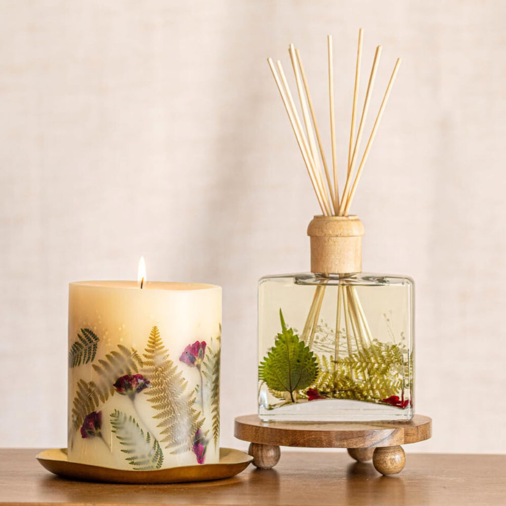 Rosy Rings Frosted Fir candle on a mantel adds subtle luxury