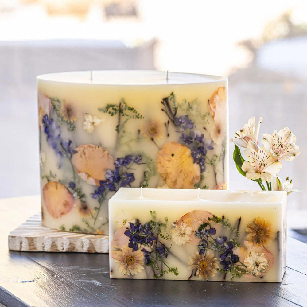 Rosy Rings Vanilla Rain brick candle highlights elegant botanicals for decorative lighting and ambiance.