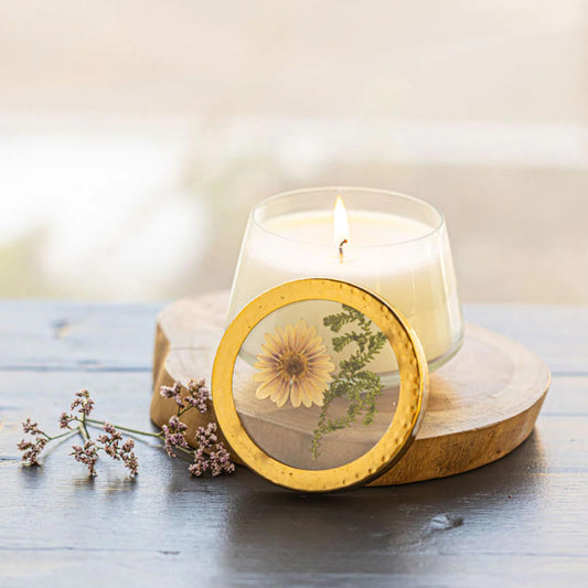Rosy Rings Vanilla Rain candle jar with pressed florals glows softly for a tranquil room
