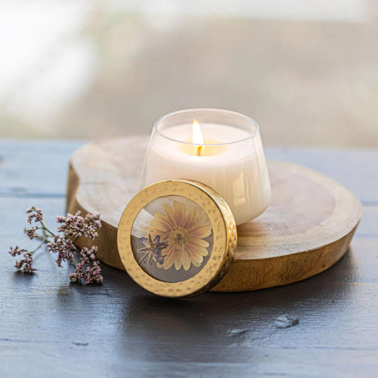 Rosy Rings Vanilla Rain pressed floral glass candle detail highlights elegant home fragrance.