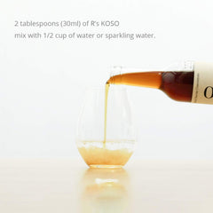 Close-up pour of R's KOSO bottle, highlighting smooth dosing for easy use