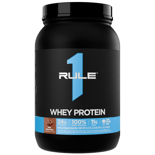Rule 1 Whey Protein bottle closeup shows premium recovery protein.