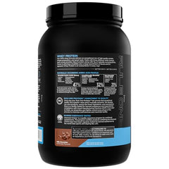 Rule 1 Whey Protein mixing glass demonstrates creamy texture for easy blending.