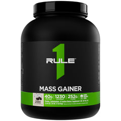 Rule 1 Mass Gainer bottle close-up showing high-calorie formula for weight gain.