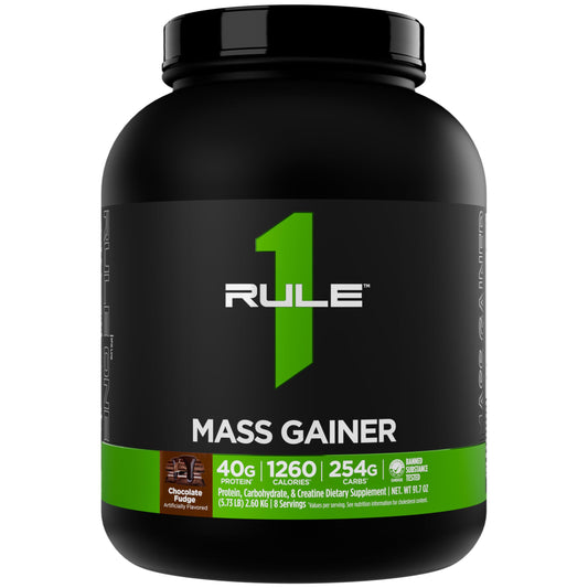 Rule 1 Mass Gainer chocolate fudge tub with scoop for high-calorie fueling.