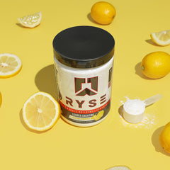 RYSE scoop beside powder demonstrates precise serving for consistent results.