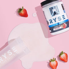 RYSE Loaded Pink Splash pouring into shaker for a ready-to-workout mix.