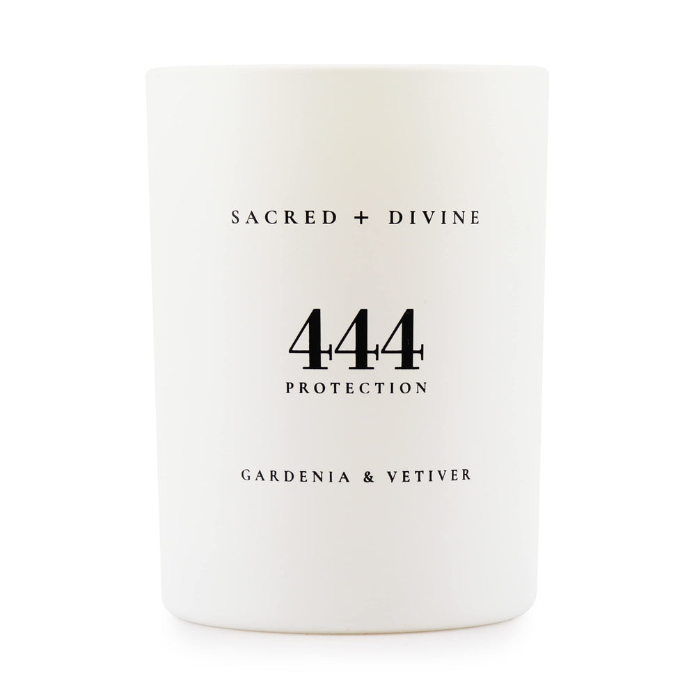 Sacred + Divine 444 protection candle in gardenia-vetiver jar for calm focus.