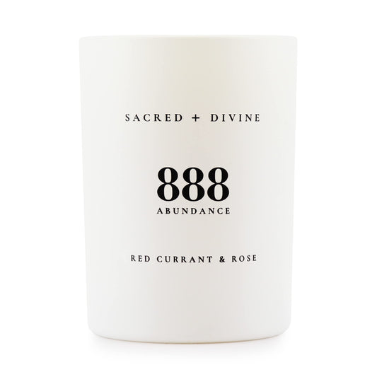 Sacred + Divine 888 abundance candle in a minimalist jar for focused intention setting.