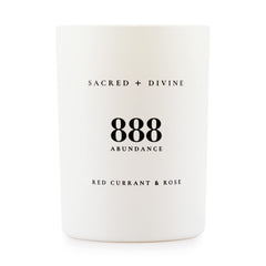 Sacred + Divine 888 abundance candle in a minimalist jar for focused intention setting.